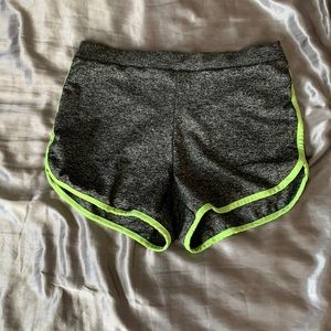 Grey workout shorts with neon green stripes